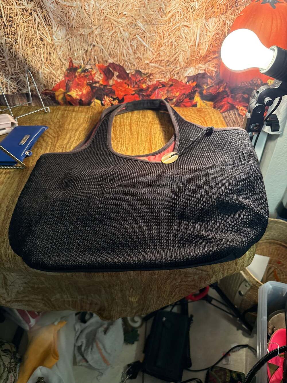 The Sak Black Crochet Knit Shoulder Bag with Mauve Interior Lining